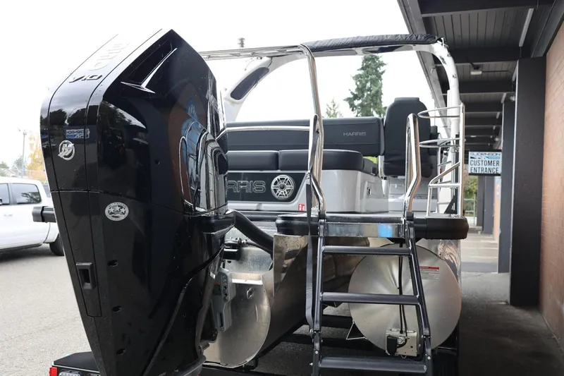 Slide: The Image of 2026 Harris Grand Mariner 250 boat with powerful outboard motor and sleek design. - 58