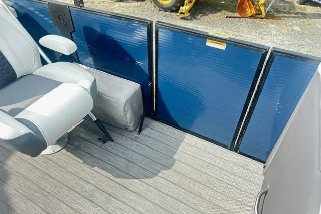 Slide: The Image of 2021 Godfrey Monaco 235RL Tri Toon interior with seating and blue paneling. - 11