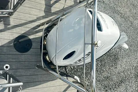 Slide: The Image of 2021 Godfrey Monaco 235RL Tri Toon boat engine with protective railing on deck. - 13