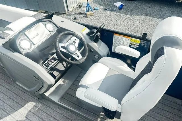 Slide: The Image of 2021 Godfrey Monaco 235RL Tri Toon boat cockpit with steering wheel and captain's chair. - 4