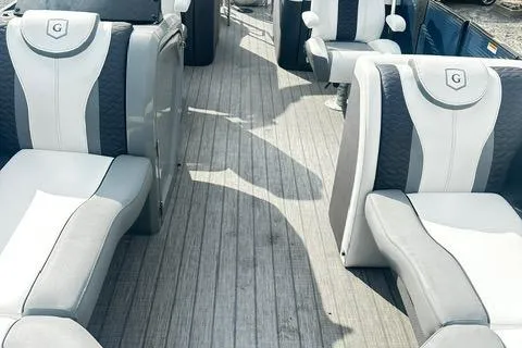 Slide: The Image of 2021 Godfrey Monaco 235RL Tri Toon boat interior with luxurious seating. - 7