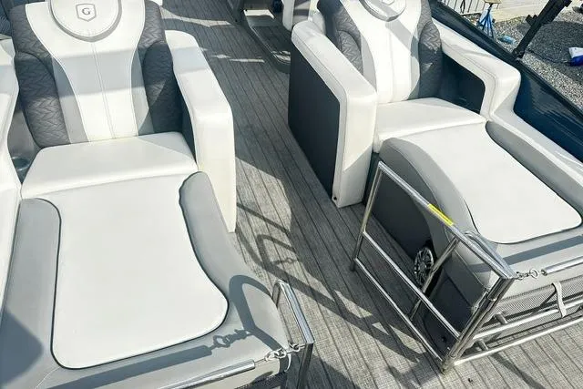 Slide: The Image of 2021 Godfrey Monaco 235RL Tri Toon boat interior with luxurious seating. - 8