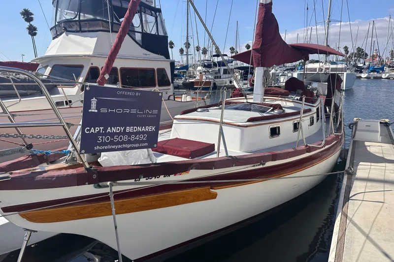 Slide: The Image of 1978 Tayana Mariner sailboat docked, offered by Shoreline Yacht Group, contact Capt. Andy Bednarek. - 10