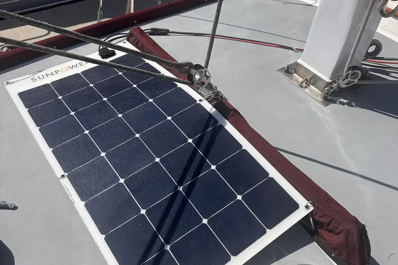 Slide: The Image of Solar panel on 1978 Tayana Mariner sailboat deck, featuring SunPower technology. - 17