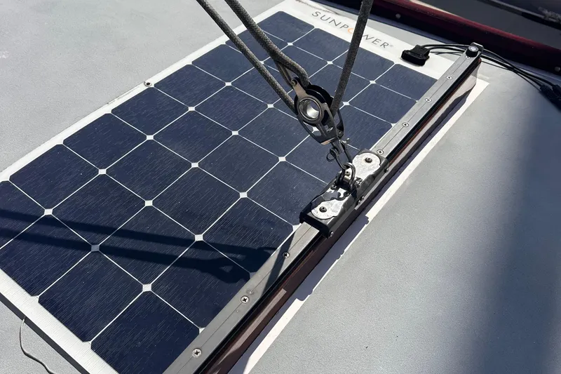 Slide: The Image of Solar panel on 1978 Tayana Mariner sailboat deck with rigging hardware. - 30