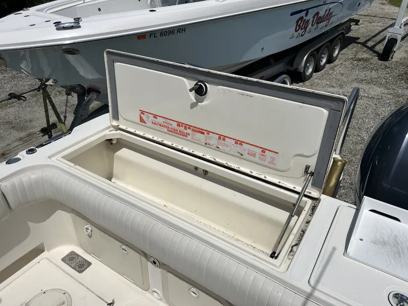 Slide: The Image of Open storage compartment on a 2002 World Cat 266SC boat. - 10