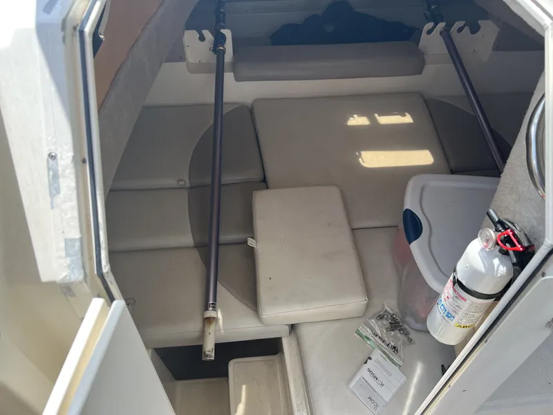Slide: The Image of Interior of a 2002 World Cat 266SC boat with fire extinguisher. - 13