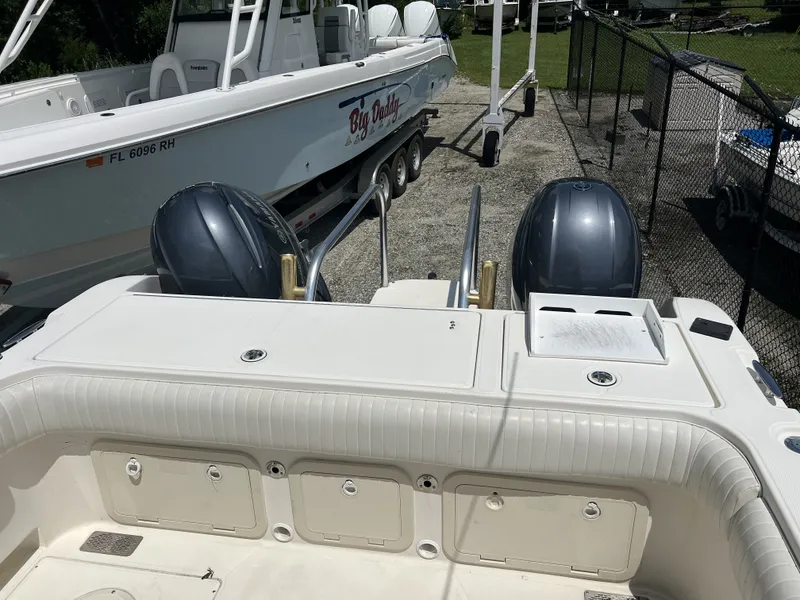 Slide: The Image of Rear view of a 2002 World Cat 266SC boat with dual engines. - 14