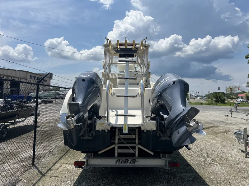 Slide: The Image of 2002 World Cat 266SC boat with dual outboard motors on trailer. - 2