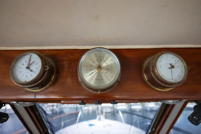Slide: The Image of 1973 Hatteras 58 Yacht Fisherman dashboard with vintage gauges and instruments. - 38