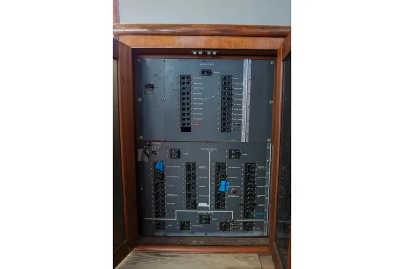 Slide: The Image of Electrical panel of a 1973 Hatteras 58 Yacht Fisherman, featuring circuit breakers. - 40