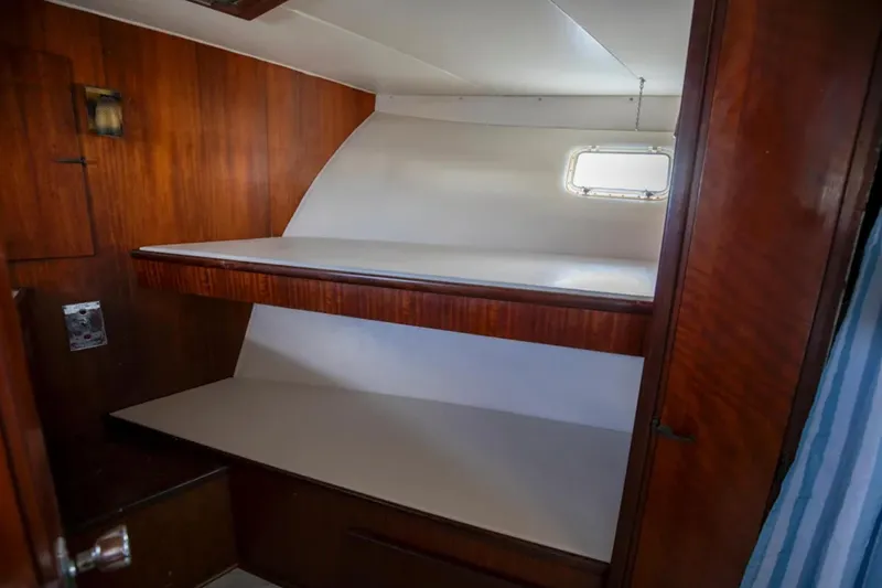 Slide: The Image of Interior cabin of 1973 Hatteras 58 Yacht Fisherman with wooden bunk beds. - 48