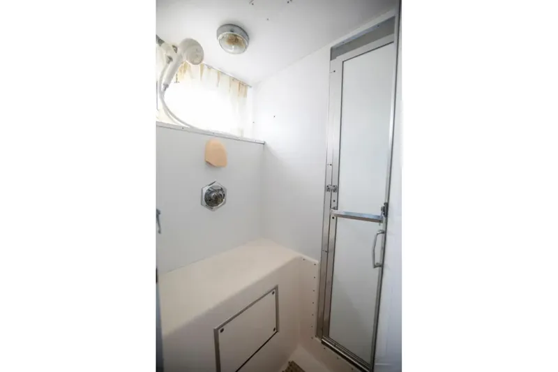 Slide: The Image of 1973 Hatteras 58 Yacht Fisherman bathroom with shower and glass door. - 66