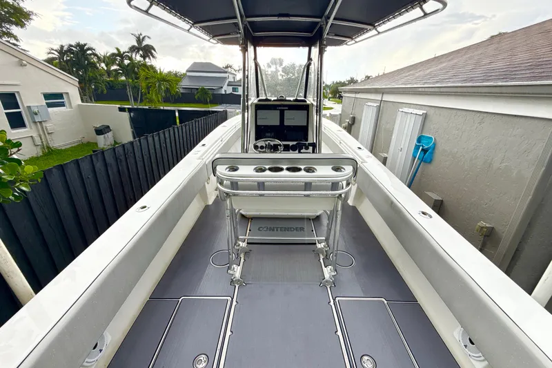 Slide: The Image of 2005 Contender 27 Open boat with sleek deck and modern console. - 10