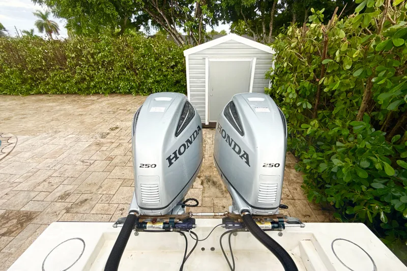 Slide: The Image of Twin Honda 250 outboard engines on a 2005 Contender 27 Open boat. - 8