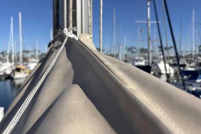 Slide: The Image of Close-up of a sail on a 1997 Beneteau Oceanis 400 yacht in a marina. - 18