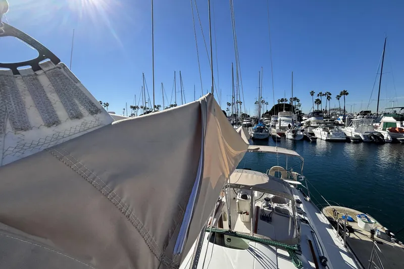Slide: The Image of Beneteau Oceanis 400 sailboat docked in a sunny marina, 1997 model. - 22