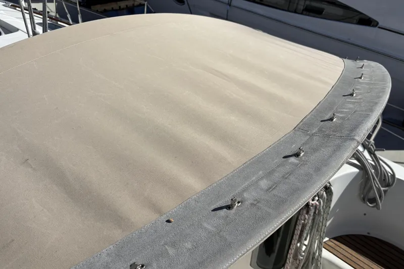 Slide: The Image of Beneteau Oceanis 400 sailboat bimini top, 1997 model, beige fabric with fasteners. - 25