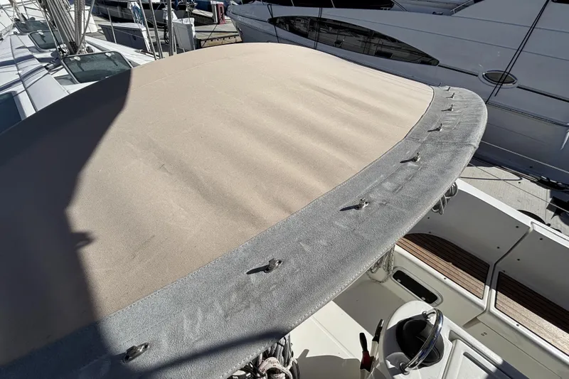 Slide: The Image of Beneteau Oceanis 400 sailboat cockpit with beige canvas cover, 1997 model. - 26