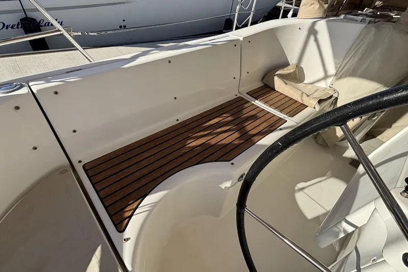 Slide: The Image of 1997 Beneteau Oceanis 400 cockpit with wooden flooring and steering wheel. - 37