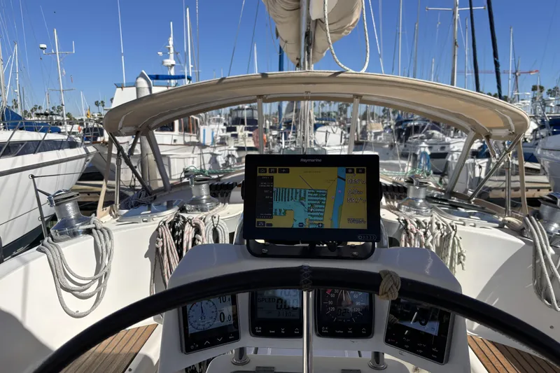 Slide: The Image of Cockpit view of a 1997 Beneteau Oceanis 400 sailboat with navigation equipment. - 40