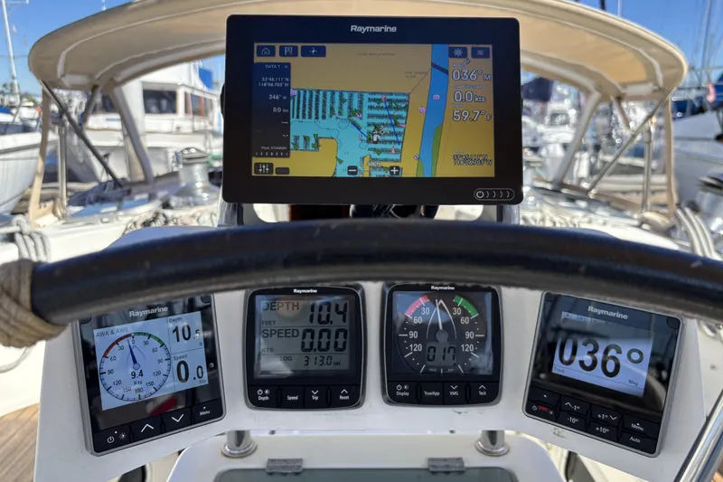Slide: The Image of Cockpit of 1997 Beneteau Oceanis 400 with Raymarine navigation instruments and chartplotter display. - 42