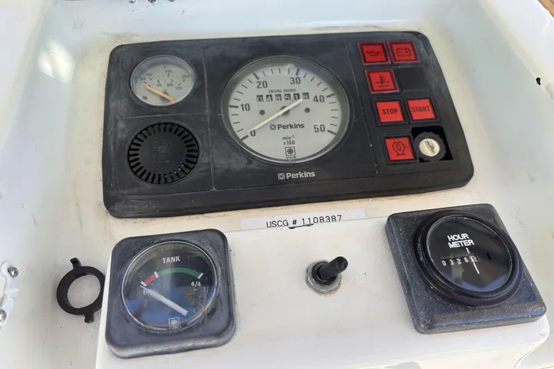 Slide: The Image of Control panel of a 1997 Beneteau Oceanis 400 sailboat with gauges and switches. - 43
