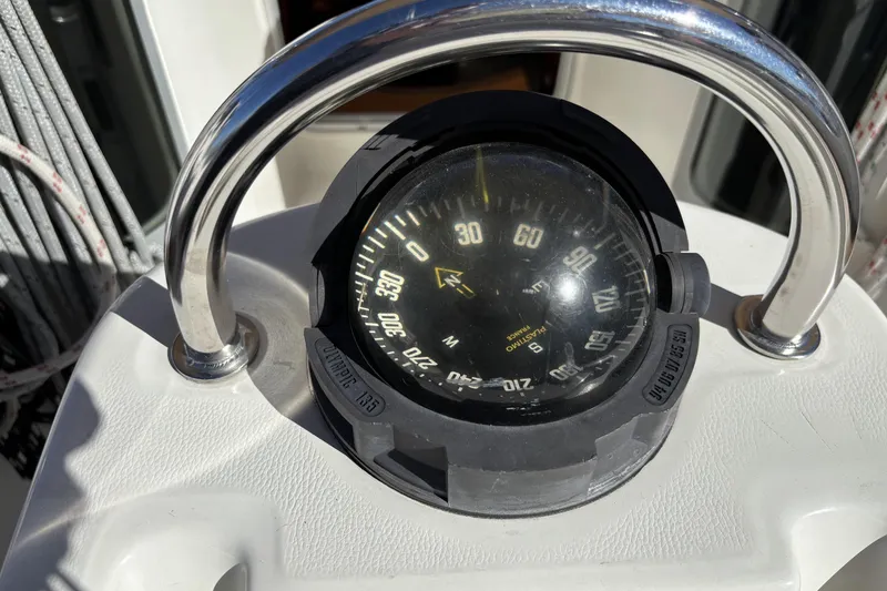 Slide: The Image of Compass on 1997 Beneteau Oceanis 400 sailboat, surrounded by stainless steel guard. - 44