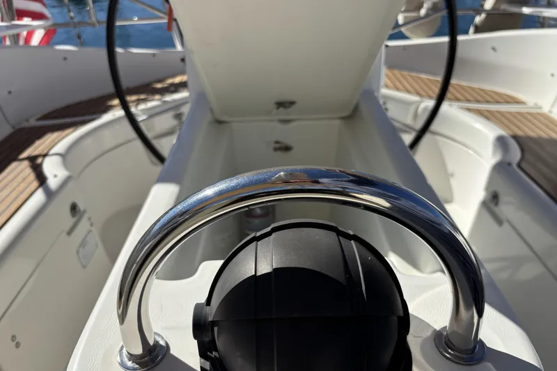 Slide: The Image of Cockpit view of 1997 Beneteau Oceanis 400 sailboat with steering wheel and open hatch. - 46