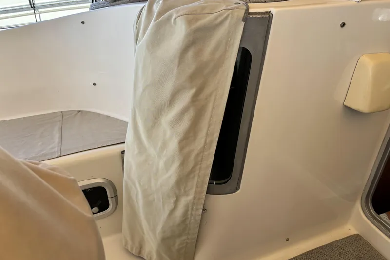 Slide: The Image of Interior view of a 1997 Beneteau Oceanis 400 sailboat with beige fabric cover. - 47