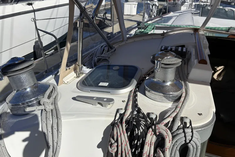 Slide: The Image of Deck of 1997 Beneteau Oceanis 400 sailboat with winches and ropes. - 49