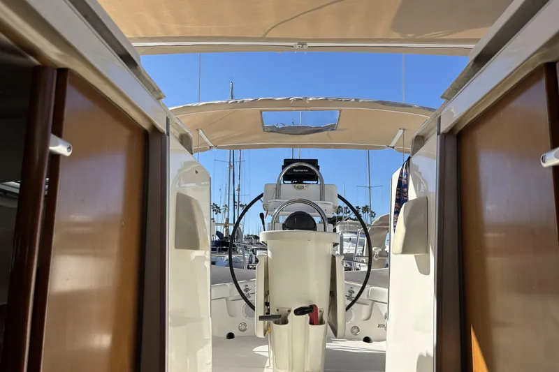 Slide: The Image of Interior view of 1997 Beneteau Oceanis 400 sailboat cockpit with steering wheel. - 52