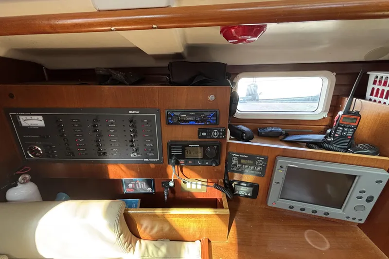 Slide: The Image of Interior view of a 1997 Beneteau Oceanis 400 yacht's navigation and control panel. - 57