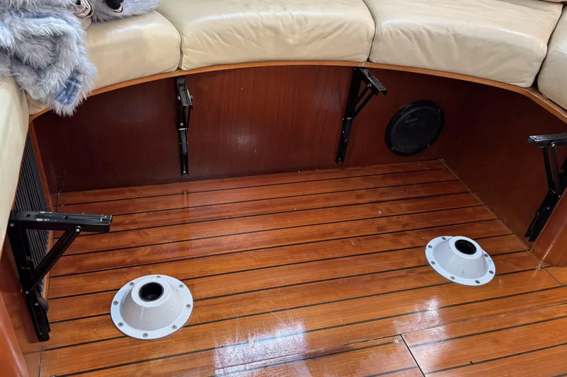 Slide: The Image of Interior of 1997 Beneteau Oceanis 400 yacht with wooden flooring and beige seating. - 60