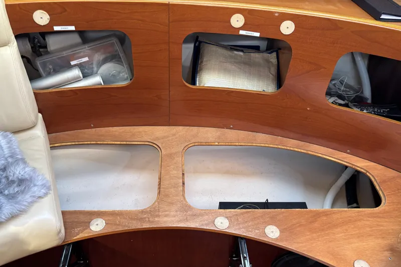 Slide: The Image of Interior view of a 1997 Beneteau Oceanis 400 sailboat with wooden storage compartments. - 62
