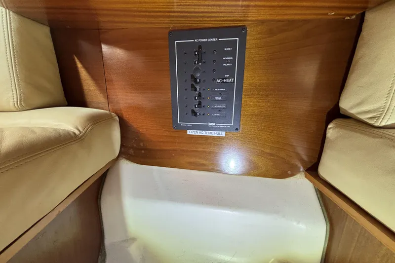 Slide: The Image of Control panel on a 1997 Beneteau Oceanis 400 yacht interior with beige seating. - 63