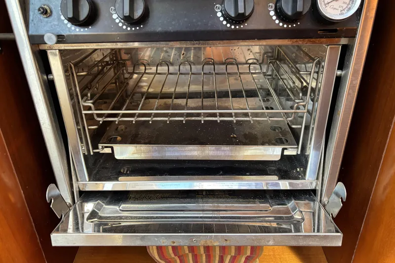 Slide: The Image of Stainless steel oven inside a 1997 Beneteau Oceanis 400 sailboat galley. - 69