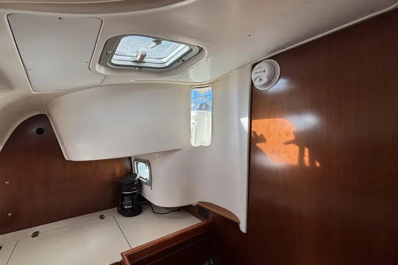 Slide: The Image of Interior of 1997 Beneteau Oceanis 400 sailboat with wood paneling and ceiling hatch. - 71