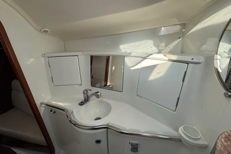 Slide: The Image of Interior view of 1997 Beneteau Oceanis 400 yacht bathroom with sink and mirror. - 77