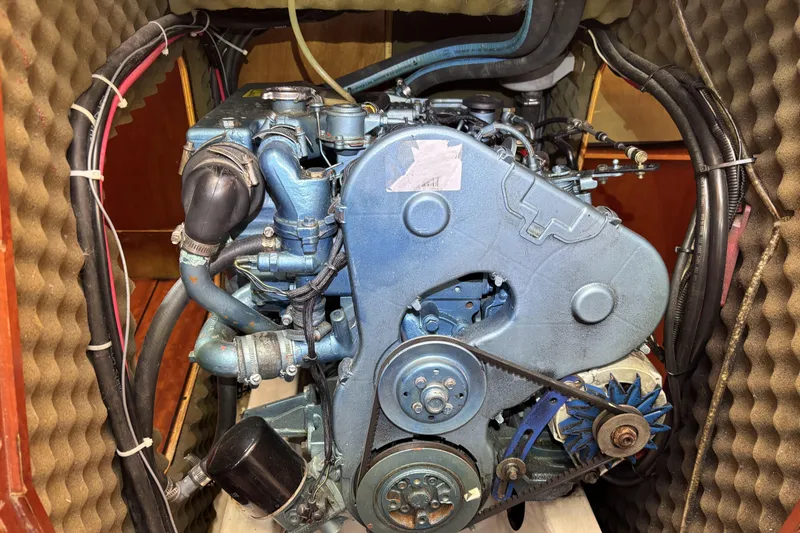 Slide: The Image of Engine of a 1997 Beneteau Oceanis 400 sailboat, showcasing mechanical components. - 86