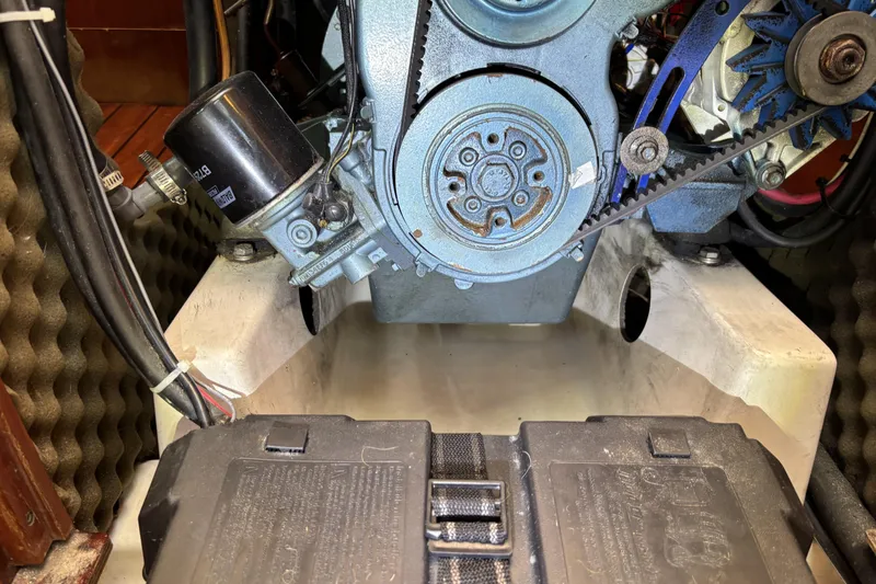 Slide: The Image of Engine compartment of a 1997 Beneteau Oceanis 400 sailboat, showing mechanical components. - 87