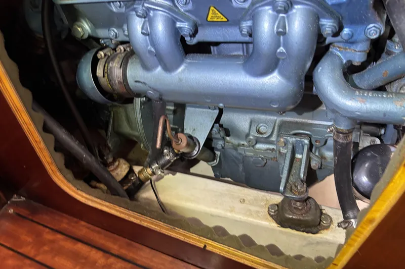 Slide: The Image of Engine compartment of a 1997 Beneteau Oceanis 400 sailboat, showcasing mechanical components. - 88