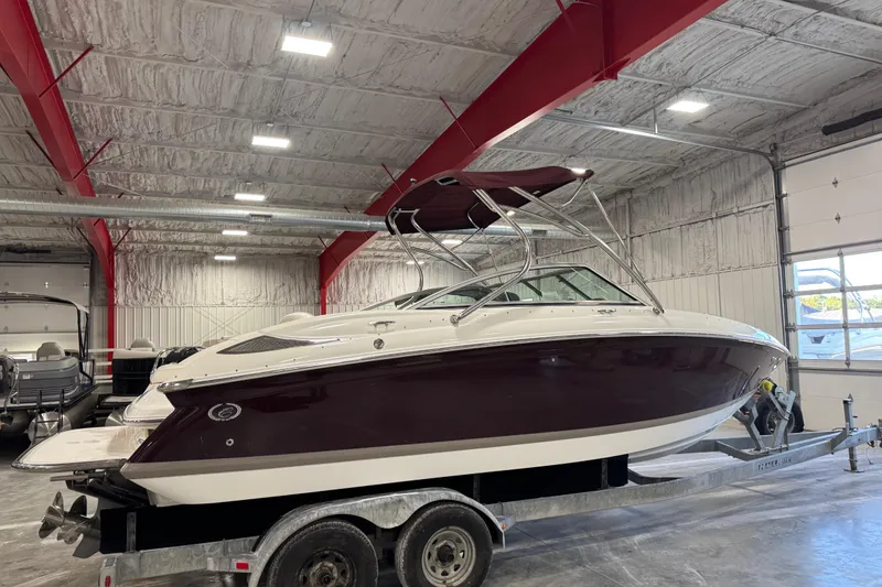 Slide: The Image of 2007 Cobalt 232 boat on trailer in indoor storage facility. - 4