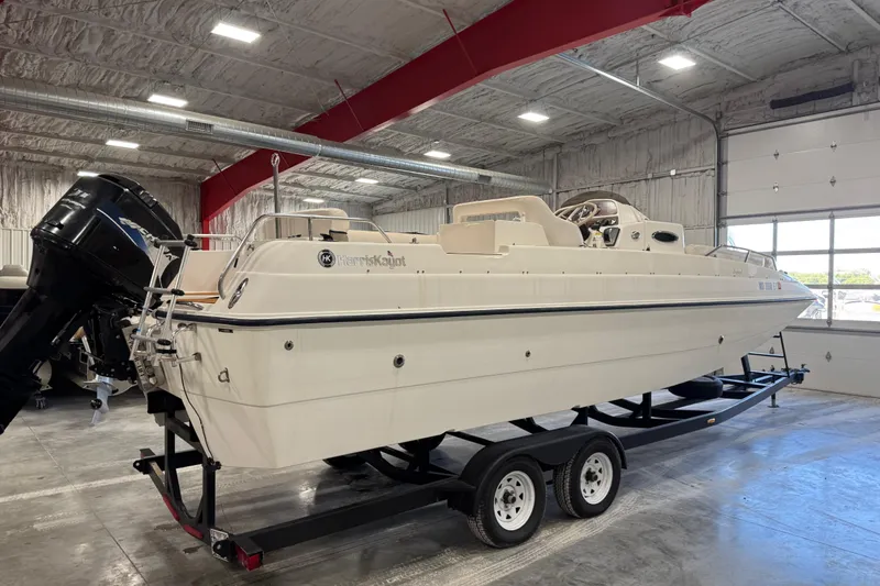 Slide: The Image of 2000 Harris-Kayot 24 Legend boat on trailer in indoor storage facility. - 5