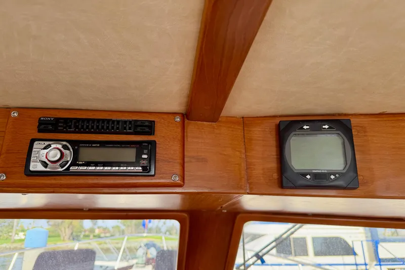 Slide: The Image of Interior of 1988 Offshore Yachts 48 Sedan with Sony stereo and control panel. - 51