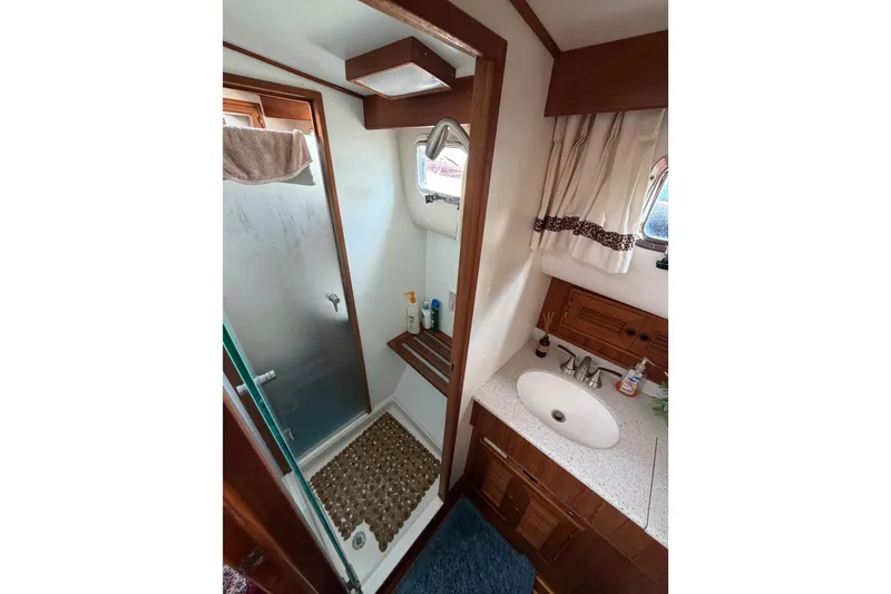 Slide: The Image of Bathroom interior of 1988 Offshore Yachts 48 Sedan with shower and sink. - 62
