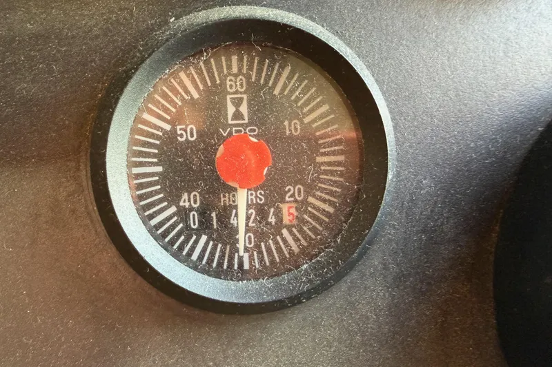 Slide: The Image of Hour meter on 1988 Offshore Yachts 48 Sedan dashboard, showing 1425 hours. - 89