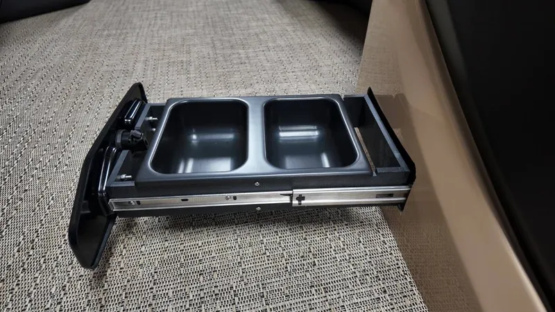 Slide: The Image of Barletta Cabrio 22QC 2026, retractable dual cup holder on carpet. - 29