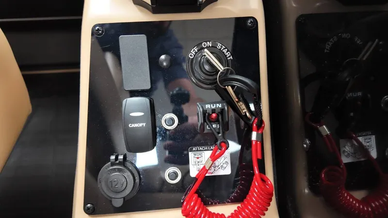 Slide: The Image of Dashboard of Barletta Cabrio 22QC 2026 with ignition key and switches. - 42