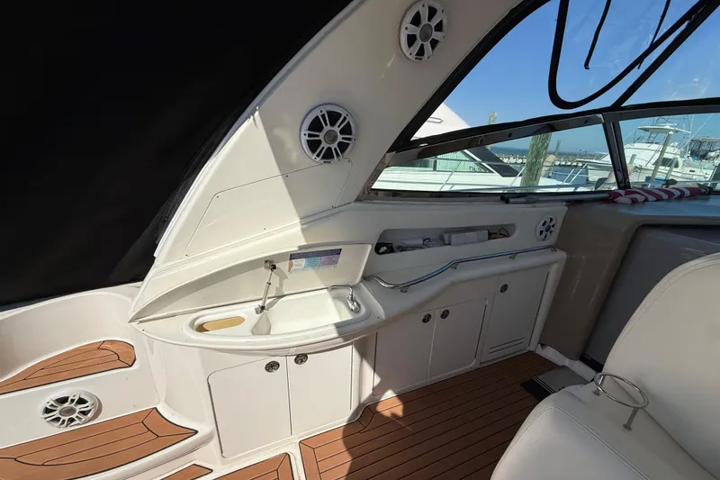 Slide: The Image of Helm of 2003 Sea Ray 460 Sundancer with Raymarine electronics and wooden steering wheel. - 19